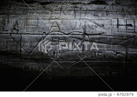 A heart shape carved into seasoned timber, with a romantic message. 9702979