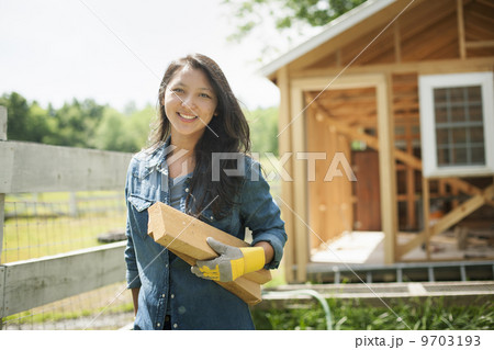A young woman on a traditional farm in the countryside of New York State, USA A young woman on a traditional farm in the countryside of New York State, USA 9703193