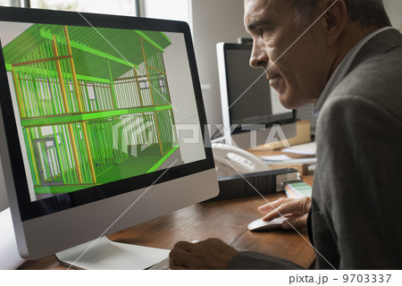 Architects discussing a green construction project, designing and building efficient environmentally friendly buildings. Green architectural practice. 9703337