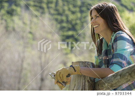 A young woman with long black hair, outdoors in the fresh air. 9703344