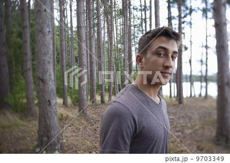 A young man in woodland. A young man in woodland. 9703349