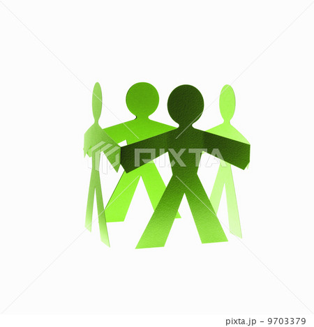 Papercuts, paper cut out figures representing people with joined hands. 9703379