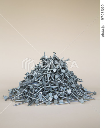 A heaped pile of galbanised nails. 9703390