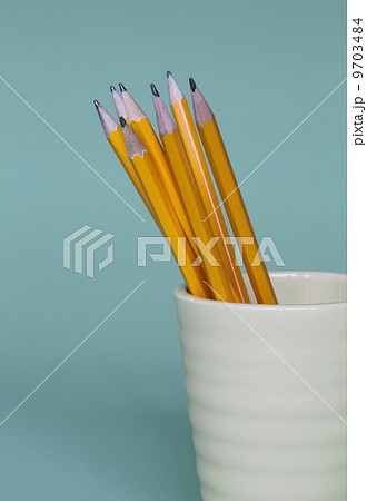Sharpened pencils in cup, on a blue background. Sharpened pencils in cup, on a blue background. 9703484