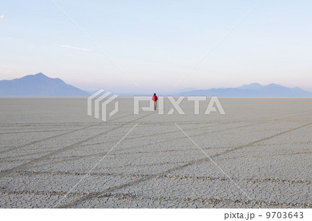 A man in the flat playa, salt pan, of Black Rock Desert, Nevada. A man in the flat playa, salt pan, of Black Rock Desert, Nevada. 9703643
