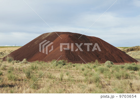 Gravel piles are used for road maintenance and construction purposes 9703654
