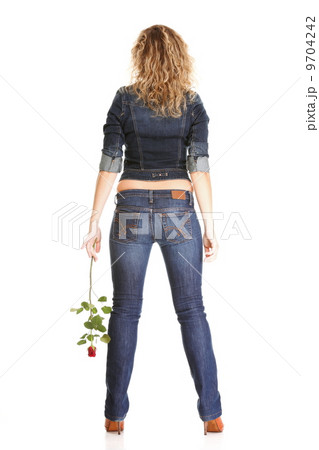 Beautiful young woman blonde in jeans romantic red rose isolated 9704242