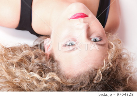 beautiful long blond curly hair of young attractive woman 9704328