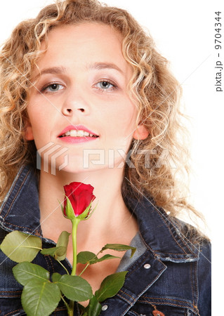 Beautiful young woman blonde in portrait romantic red rose isola Beautiful young woman blonde in portrait romantic red rose isola 9704344