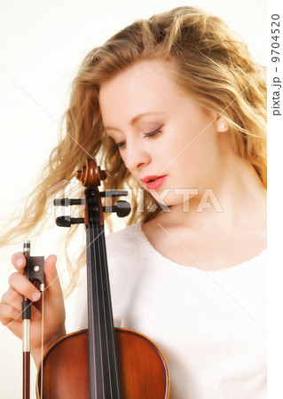 The blonde girl with a violin outdoor 9704520