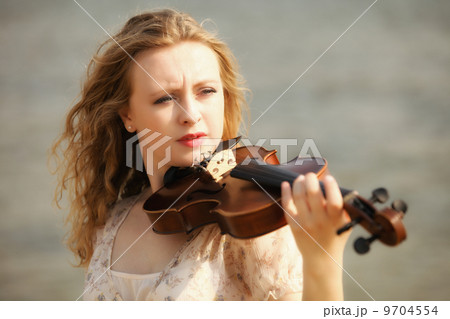Portrait blonde girl with a violin outdoor Portrait blonde girl with a violin outdoor 9704554