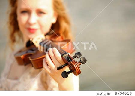 Portrait blonde girl with a violin outdoor Portrait blonde girl with a violin outdoor 9704619