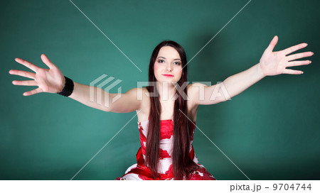 young woman with outstretched arms 9704744