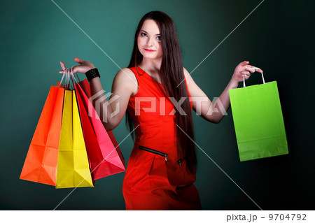 young woman with paper multi coloured shopping bag young woman with paper multi coloured shopping bag 9704792