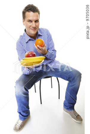 young man with fruits healthy diet isolated 9705036