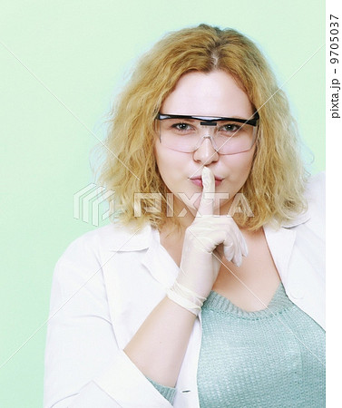 chemist woman showing silence gesture isolated chemist woman showing silence gesture isolated 9705037