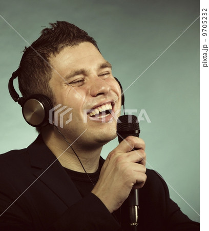 man singing into microphone happy karaoke signer 9705232