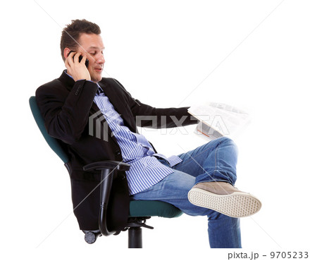 man reads newspaper phoning - economy news 9705233