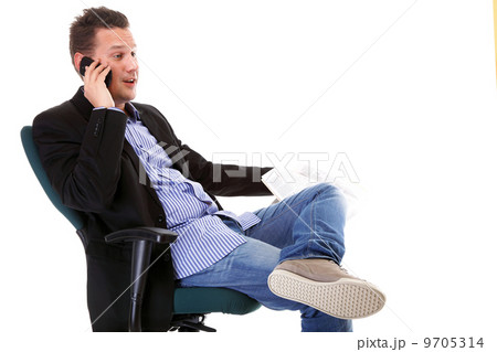 man reads newspaper phoning - economy news 9705314