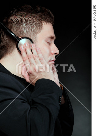 young man with headphones listening to music 9705390