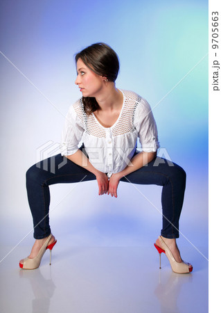 Full body woman in casual clothes relaxed pose 9705663