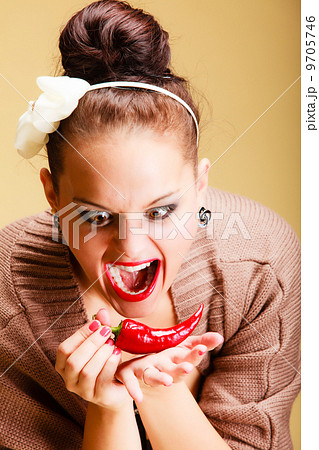 Face expression woman sexy girl biting spicy hot red cayenne chilli pepper Face expression woman sexy girl biting spicy hot red cayenne chilli pepper 9705746