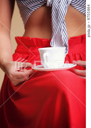 Woman holding tea or coffee cup Woman holding tea or coffee cup 9705864