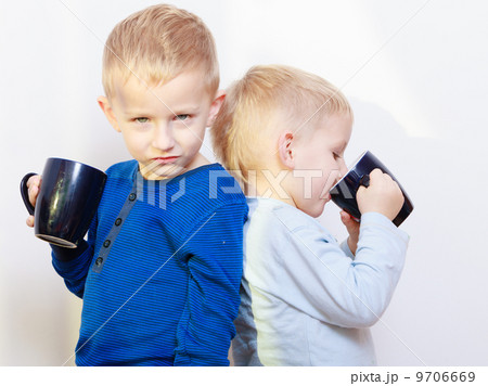 Happy childhood. Two brothers little boys drinking tea 9706669