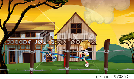 Kids playing seesaw in front of the wooden barnhouses 9708635