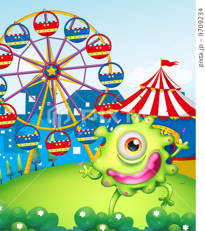 A one-eyed green monster at the carnival in the hilltop 9709234