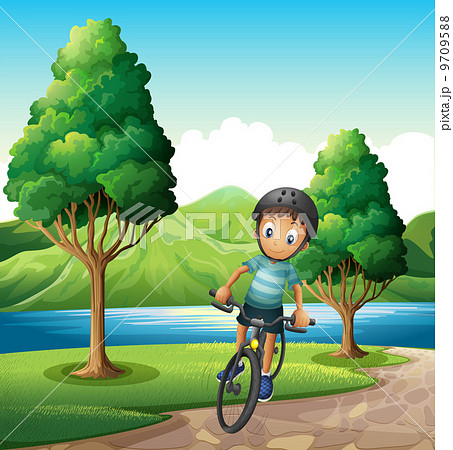 A male biker biking near the river 9709588