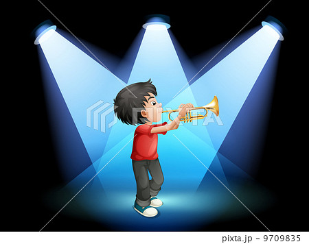 A young boy with a trumpet at the stage 9709835