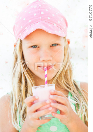 Young girl drinking smoothie Young girl drinking smoothie 9710779