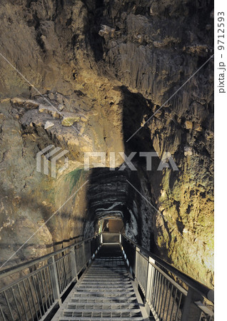 Tunnel in the rocks, leading to an ancient tank Tunnel in the rocks, leading to an ancient tank 9712593