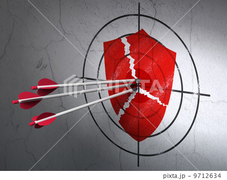 Safety concept: arrows in Broken Shield target on wall background Safety concept: arrows in Broken Shield target on wall background 9712634