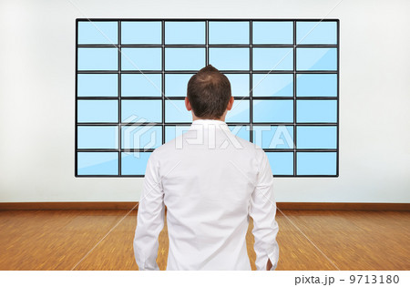 businessman looking on plasma 9713180