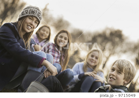 Five children on a farm. Boys and girls in warm jackets outdoors. Five children on a farm. Boys and girls in warm jackets outdoors. 9715049