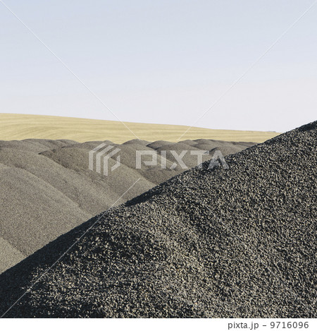 Gravel piles used for road maintenance and construction, a row of heaps near Pullman, Washington, USA. Gravel piles used for road maintenance and construction, a row of heaps near Pullman, Washington, USA. 9716096