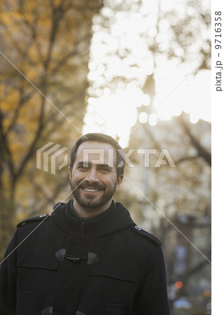 Man walking in urban park 9716358