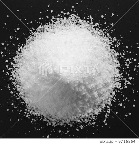 Pile of coarse sea salt grains on a black background. 9716864