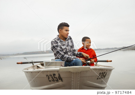 A day out at Ashokan lake. Two boys sitting fishing from a boat. 9717484