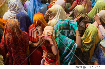 A colorful crowd of people celebrate the Holi Festival, Mathura, Uttar Pradesh, India A colorful crowd of people celebrate the Holi Festival, Mathura, Uttar Pradesh, India 9717546