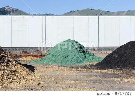 Piles of green bark wood chips used for landscaping, near Quincy Piles of green bark wood chips used for landscaping, near Quincy 9717735