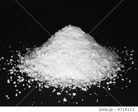 Pile of coarse sea salt grains on a black background. Pile of coarse sea salt grains on a black background. 9718121