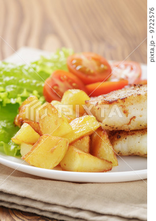 roasted codfish fillet with vegetables roasted codfish fillet with vegetables 9722576