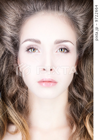 Portrait of a young woman with hair volume. Portrait of a young woman with hair volume. 9722664