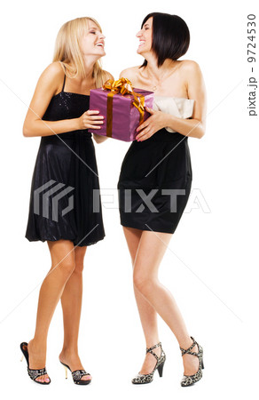 Pretty festive girls with a gift box 9724530