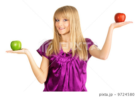 Beautiful girl holding two fresh apples Beautiful girl holding two fresh apples 9724580