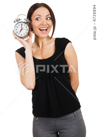 Beautiful young woman with vintage alarm clock 9726894
