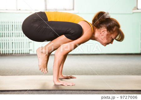 Mature woman exercising yoga Mature woman exercising yoga 9727006